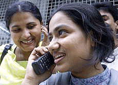 A Bangladeshi student talks on a mobile phone at Dhaka University campus on Sunday.