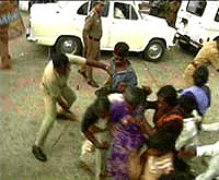 Groups of DMK volunteers, who became violent on seeing former Chief Minister M. Karunanidhi lodged in Central Prison, were chased away by the police at Chennai on Saturday.