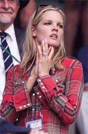 Bridgette Wilson, wife of Pete Sampras of the U.S., watches him play Switzerland's Roger Federer during their fourth round match at Wimbledon on Monday.