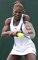 Serena Williams of the U.S plays a return to Bulgaria's Magdalena Maleeva during their fourth round match at Wimbledon on