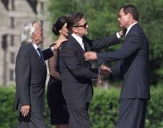 Actor Michael Douglas his wife, actress Catherine Zeta Jones, and his father Kirk Douglas (L) greet Chris Lemmon (R), son of Jack Lemmon, as they arrive at Pierce Brothers Westwood Village Memorial Park for the funeral of actor Jack Lemmon, in Los Angeles on Sunday.