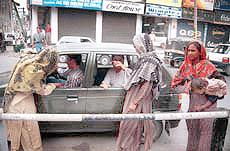 While their men strive hard to earn a livelihood in Srinagar during hot summer, these women from outside Kashmir, mostly take to the plush market places with begging bowls. 