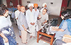 Ms Jyoti Arora, Deputy Commissioner, Panchkula (extreme right), listens to complaints in khula darbar in the community centre, Sector 10, Panchkula, on Tuesday. 