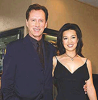 Actor James Woods (left) and actress Ming Na, the voices of General Hein and Aki, respectively, in the sci-fi, animated fantasy adventure motion picture Final Fantasy: The Spirits Within, share a laugh during the premiere of the film, on Monday in the Westwood section of Los Angeles. 
