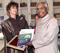 President K. R. Narayanan showing the UNDP's human development report 2001 "Making technology work for human development" after it was presented to him by UNDP residential representative Dr Brenda Gael McSweeney at Rashtrapati Bhawan in New Delhi on Wednesday.