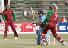 Indian batsman Sachin Tendulkar, West Indies bowler Neill McGarrell and wicket keeper Ridley Jacobs watch a sweep shot down the leg side on Wednesday. 