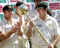 Australia's captain Steve Waugh, right, holding the ICC Test Championship Trophy at Edgbaston, Birmingham, England on Wednesday.