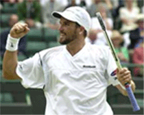 Australias Pat Rafter celebrates beating Swedens Thomas Enqvist during their mens quarter finals match at Wimbledon on Wednesday.