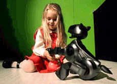 Three-year-old Samantha Kraft plays with the first Sony AIBO, short for Artificially Intelligent Robot, at its Australian launch in Sydney on Thursday.  