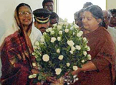 Tamil Nadu Chief Minister J. Jayalalitha offering a bouquet to former Governor Fathima Beevi at Chennai Airport where she was given a send off on Thursday.