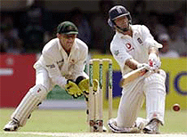 England's captain Nasser Hussain plays a shot off Australia's Shane Warne watched by wicketkeeper Adam Gilchrist (L) in the Ashes Tour match at Edgbaston on Thursday.