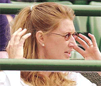 Former womens champion Steffi Graf watches the mens singles quarterfinal match between Andre Agassi and Frances Nicolas Escude on the Number One Court at Wimbledon on Wednesday.