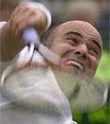 Andre Agassi, serves to France's Nicolas Escude, during their men's singles quarterfinal match on the Number One Court at Wimbledon on Wednesday. 