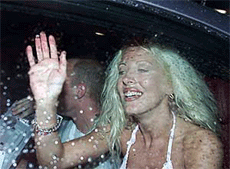 French reality television show `Loft Story' winner Loana (R) waves as she sits next to co-winner Christophe as they leave the studios near Paris, on Thursday.