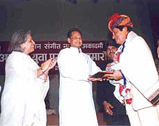 Bollywood actor Asrani receiving Rajasthan Sangeet Academy fellowship from Rajasthan Cheif Minister Ashok Gehlot in Jaipur.