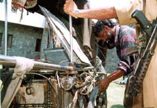 Vikas Singh globe-trotter repairs his unique cycle at the Wagah border before leaving for Delhi on Friday.