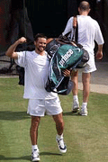Pat Rafter (L) of Australia celebrates beating Andre Agassi of the U.S. in their men's semifinal match at Wimbledon on Friday. 