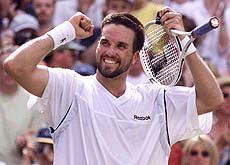 Pat Rafter of Australia celebrates beating Andre Agassi of the U.S. in their men's semifinal match at Wimbledon on Friday.