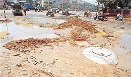 A view of the partially laid portion of road from Gill Road to Pahwa Hospital. 