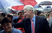 Former U.S. President Bill Clinton shakes hands with well-wishers as he arrives at Wimbledon on Saturday.