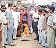 Youth Congress activists burn sackful of rubbish symbolising terrorism, in Ludhiana on Sunday. 