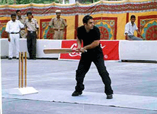 Amir Khan, actor-producer of the film "Lagaan," playing cricket.