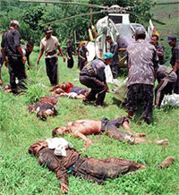 Nepalese police collect the bodies of fellow police officers killed by Maoist rebels at Bichour in Lamjung, 150 km west of Kathmandu, on Saturday.