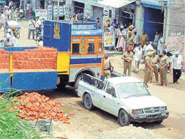 Policemen deployed in Miller Ganj Market, Ludhiana, on Monday to avert any untoward incident.