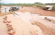The washed away causeway on the Patiala Ki Rao in Nadda village.