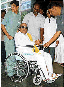 Former Tamil Nadu Chief Minister M. Karunanidhi coming out of the corporate Apollo Hospitals in a wheel chair in Chennai on Monday after his discharge. 