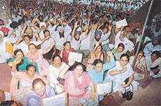 Members of the Employees Federation of the PSEB staging a dharna on the Mall Road in Patiala on Tuesday. 