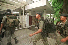 Police arrive to guard the residence of Indonesia's police commander