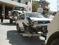 UN forces tow a vehicle 
