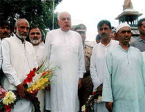 J&K Chief minister, Dr. Farooq Abdullah leading a group of people to pay homage to the martyrs of 1931 who fell  to the bullets of Maharaja's troops on this day during a protest against autocratic rule. 