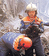 Russian servicemen of the Emergencies Ministry work at the crash cite of an IL-76 cargo plane outside Moscow on Saturday. 