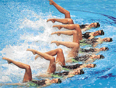 American team members display a form during women's synchronized swimming team technical routine in the ninth FINA World Swimming Championships in Fukuoka, western Japan, on Monday. 