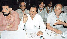 Mr Raj Kumar Goel, Mayor of the Municipal Corporation (centre), addresses a press conference in Chandigarh on Tuesday.