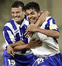 Amado Guevara (R) from Honduras is congratulated by team-mate Ricky Denis Garcia after Guevara scored his team's second goal against Bolivia during their Copa America game at Atanasio Girardot Stadium in Medellin on Monday. 
