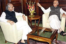 Union Home Minister L. K. Advani having a word with former Prime Minister I. K. Gujral in Home Minister's chamber in New Delhi on Wednesday. 