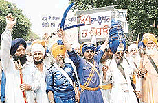 Sikhs protest against the demolition of a gurdwara in Sector 49, Chandigarh, on Wednesday.