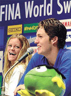 Netherlands' star swimmers Inge de Bruijn (L) and Pieter van den Hoogenband share a joke as they hold a press conference at the Marine Messe in Fukuoka, western Japan, on Wednesday. 