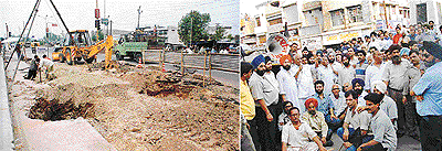 Work on the Rs 33-crore elevated road project begins from the Chand Cinema side on the old G.T. Road on Thursday; and (right) shopkeepers stage a dharna in protest against the project. 