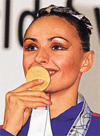 Synchronised swimming solo event winner Olga Brusnikina of Russia kisses her gold medal on a podium after the final in the World Swimming Championships in Fukuoka on Thursday. 