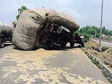 An overloaded tractor-trailer overturned on the GT Road (National Highway No 1) near Amaltas. Though none was seriously hurt, traffic remained disrupted for several hours.