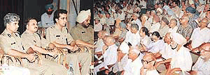 Senior police officials of the Chandigarh police at a meeting with senior citizens at Tagore Theatre, Chandigarh, on Friday.