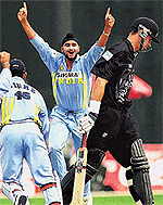 Indian bowler Harbhajan Singh celebrates after taking the wicket of New Zealand skipper Stephen Fleming (R) during the one-day match against New Zealand at R. Premadasa stadium in Colombo on Friday. 