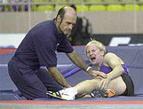 Russian polevaulter Maksim Tarasov being treated.