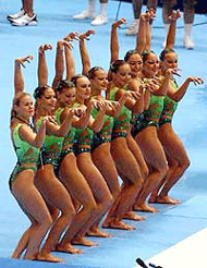 Russian team members jokingly display hand expressions.