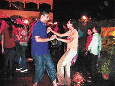 Youngsters enjoy rain dance at a resort in Ludhiana on Saturday night.