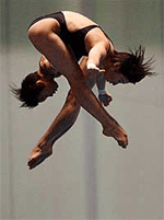 Emi Otsuki, front, and Takiri Miyazaki, back, of Japan, dive in the 10-meter Synchro Platform preliminary round trials during the 9th FINA World Swimming Championships on Sunday, in Fukuoka, Japan.